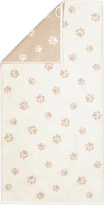 A folded towel with a paw print pattern.