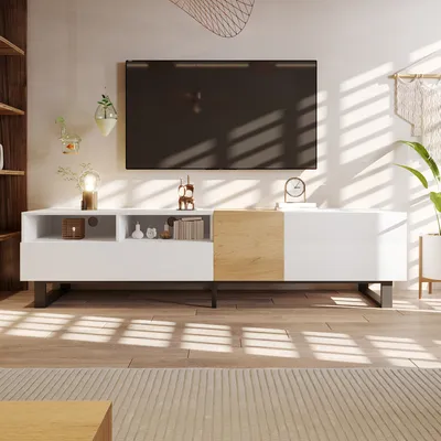 A modern living room with a TV stand and television.