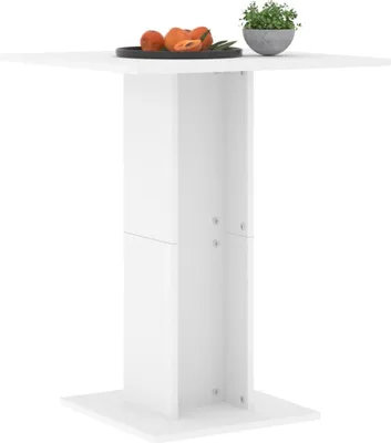 A white bar table with a tray of fruit and a small potted plant on top, set against a white background.