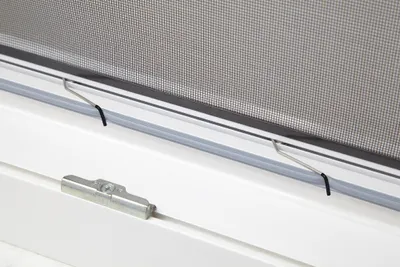 A close-up view of a window screen mechanism.