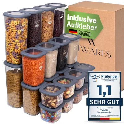 A collection of clear plastic food storage containers filled with various dry goods, arranged in a pyramid formation. A cardboard box and marketing labels are visible in the background.