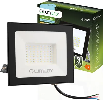 A black LED floodlight with a white faceplate is shown next to its packaging. The packaging displays product information and branding.