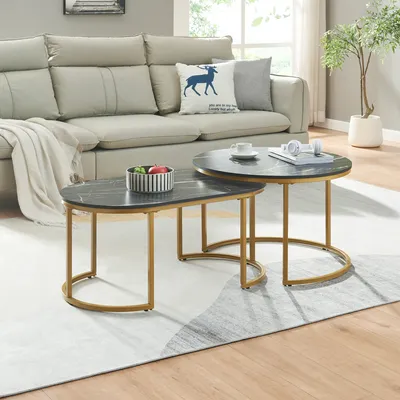 A living room scene with a sofa and nesting coffee tables.