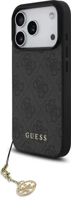 A black iPhone case with a repeating GUESS logo pattern and a gold charm attached to a lanyard.