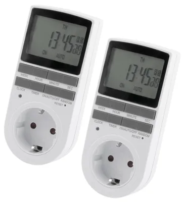 Two white digital timers with electrical outlets are shown against a white background.