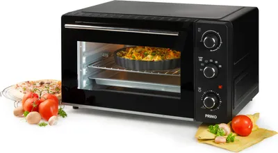 A black countertop oven with food items in front of it.