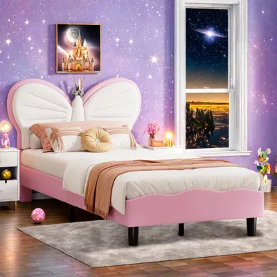 A child's bedroom with a pink bed and a starry purple wallpaper.