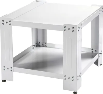 A white metal stand for a washing machine or dryer.