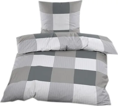 A folded duvet and pillow with a checkered pattern.