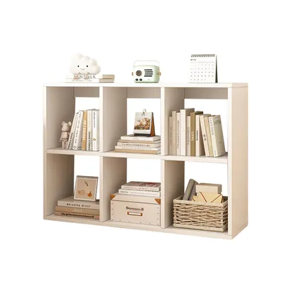 A white, six-compartment bookshelf filled with books, decorative items, and a basket.