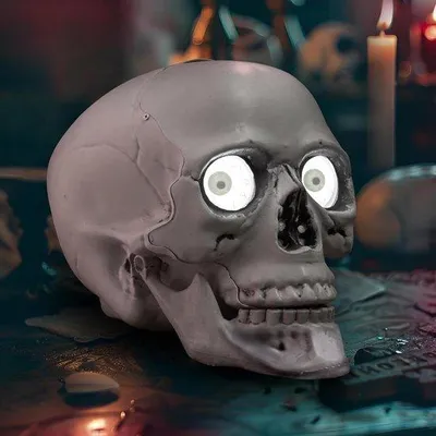 Obrázok produktu pre Halloweenska dekorácia - stolová dekorácia lebka s blikajúcimi očami - strašidelná dekorácia na halloweensku párty v interiéri - pohyblivé očné gule