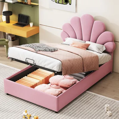 A pink upholstered bed with a shell-shaped headboard is shown with its storage compartment open, revealing stored items.