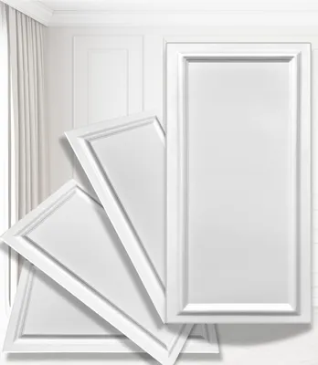 Several white decorative wall panels are arranged in a fanned-out pattern against a white wall with curtains and molding.
