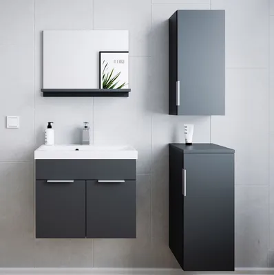 A modern bathroom vanity set with a mirror, sink, and cabinets against a tiled wall.