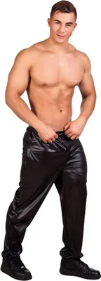 A shirtless man wearing black pants.