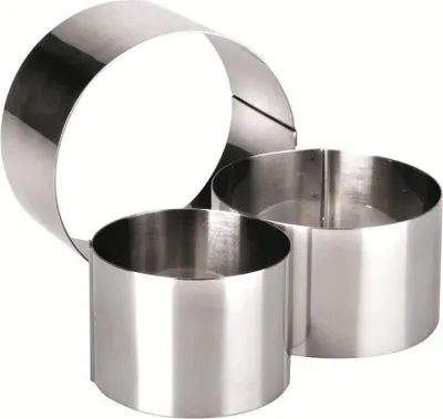 Three stainless steel cake rings of different sizes are arranged on a white background.