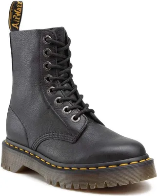 A single black Dr. Martens boot is shown against a white background.