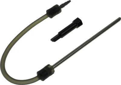 A milk hose and a connector are laid out on a white background.
