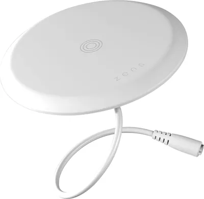 A white wireless charging pad with a coiled cable and connector.