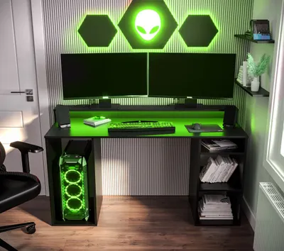 A gaming computer desk setup with dual monitors, a computer tower, and ambient green lighting.