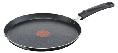 A black frying pan with a red heat indicator in the center and a black handle, set against a white background.