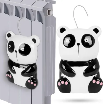 A ceramic panda-shaped radiator humidifier is shown hanging on a radiator.