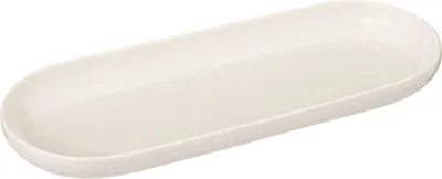 A white oval-shaped plate is shown from a slightly elevated side angle against a white background.