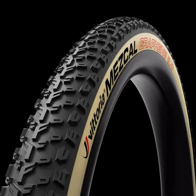 A close-up studio shot of a bicycle tire against a black background.