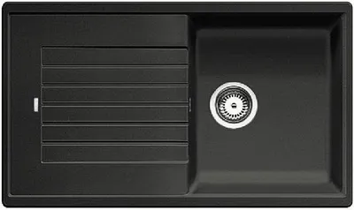 A top-down view of a black kitchen sink with a drainer.