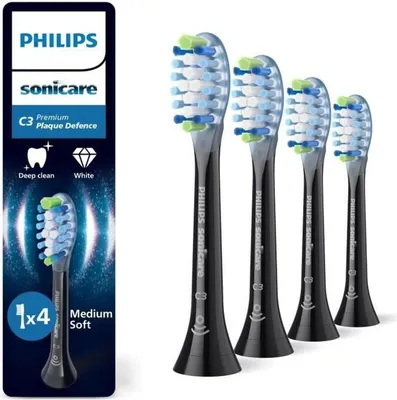 A package of four Philips Sonicare toothbrush heads with a product description on the left and the toothbrush heads lined up on the right.