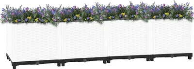 A row of four white planters filled with purple and yellow flowers, set against a white background.