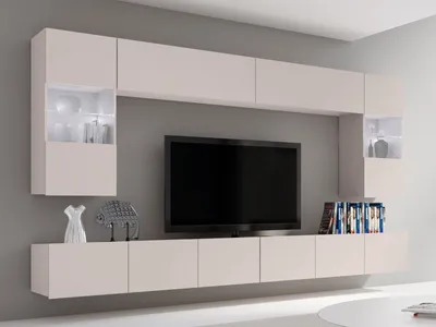 A modern living room wall unit with a TV and integrated shelving, illuminated by LED lights.