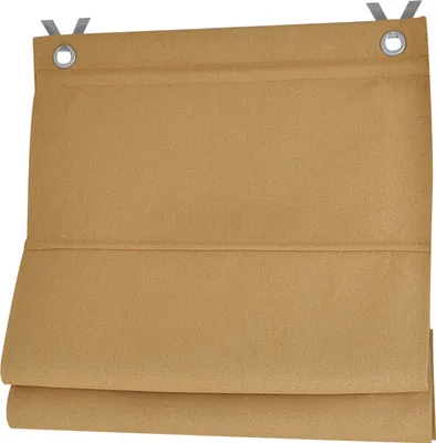 A close-up view of a folded brown fabric blind with grommets at the top.