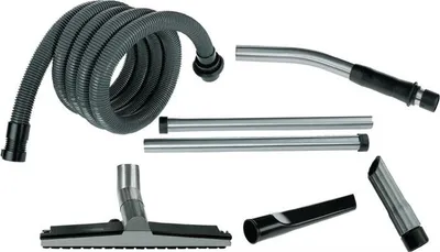 A collection of vacuum cleaner attachments laid out on a white background.