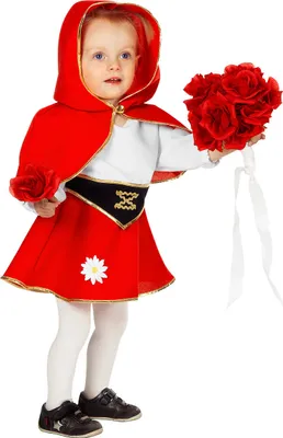 A young child dressed in a Red Riding Hood costume, holding a bouquet of red roses.