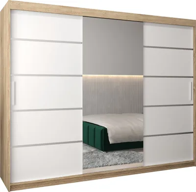 A bedroom scene reflected in a wardrobe mirror, showing a bed with a green headboard and a gray rug.