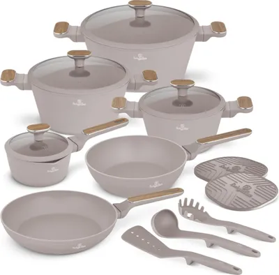 A collection of cookware and kitchen utensils arranged on a white background.