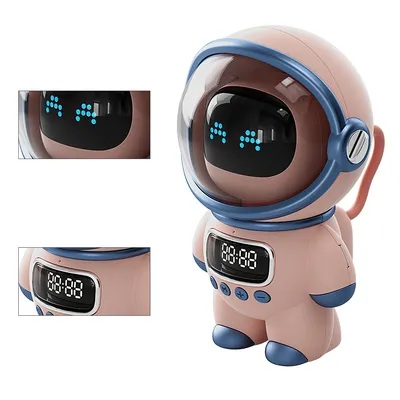 A pink astronaut-shaped speaker with a clear helmet and blue accents, displayed on a white background.