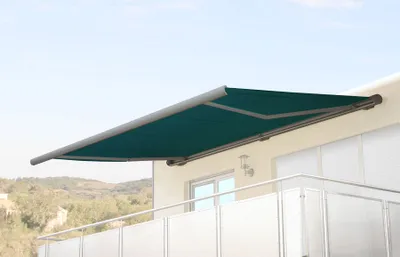 An awning is extended from a building's balcony.