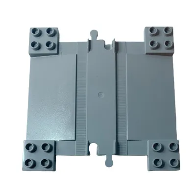 A top-down view of a light gray LEGO DUPLO train track crossing piece on a white background.