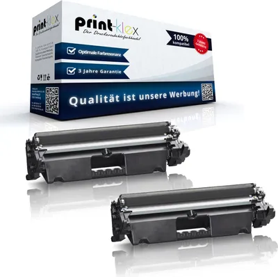 A product shot of two toner cartridges in front of their packaging.