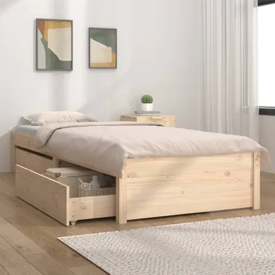 A bedroom scene with a wooden bed frame with drawers, a nightstand, and artwork on the wall.