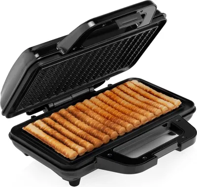 An open waffle maker with waffle sticks inside.
