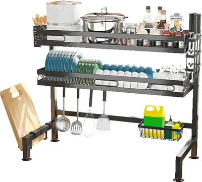 A dish drying rack filled with dishes, pots, and kitchen utensils.