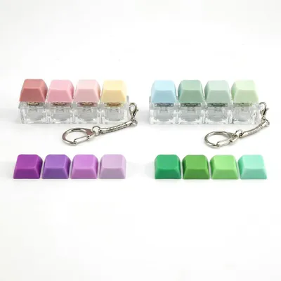 Imagen del producto de Juguetes sensoriales para aliviar el estrés, diseño de teclado, para adultos, llavero divertido. Juego de 2 unidades
