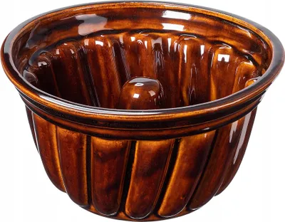 A brown ceramic gugelhupf baking mold.