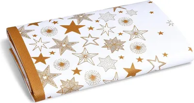 A folded white tablecloth with a gold star pattern.
