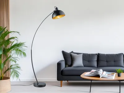 A modern living room with a black arc floor lamp, a dark gray sofa, and a coffee table.