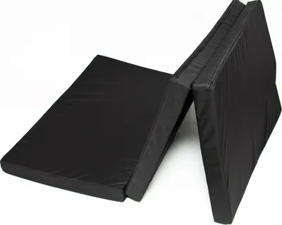 A black foldable mattress on a white background, shown partially unfolded.