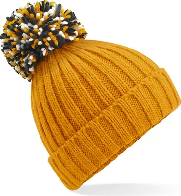 A close-up shot of a knitted beanie with a pom-pom.